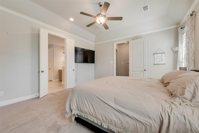 carpeted bedroom featuring lofted ceiling, ensuite bathroom, visible vents, baseboards, and crown molding