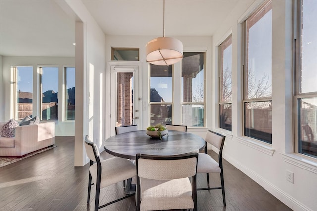 dining space with dark wood-style floors and baseboards