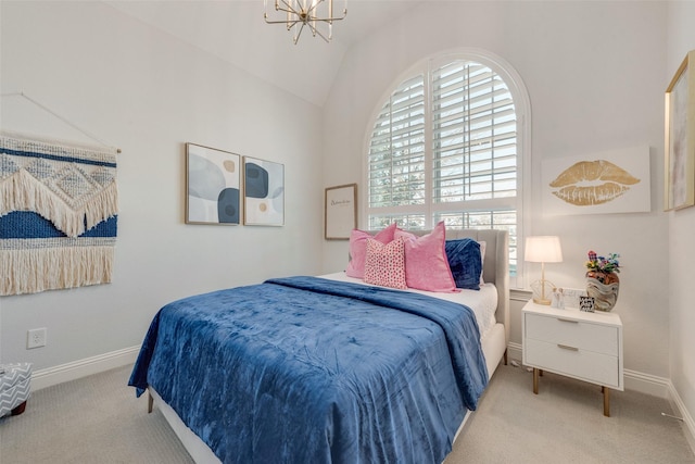 carpeted bedroom featuring vaulted ceiling, an inviting chandelier, and baseboards