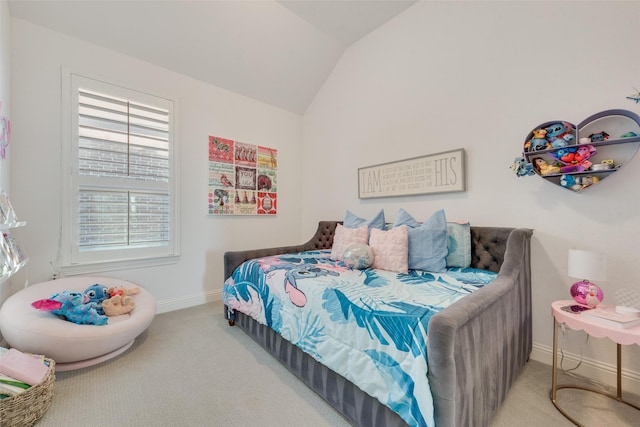 carpeted bedroom featuring vaulted ceiling and baseboards