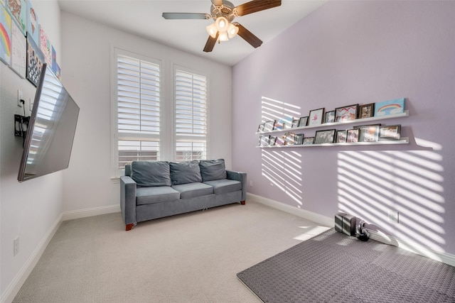 workout room with carpet floors, baseboards, and a ceiling fan