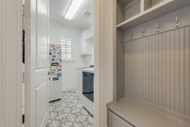 mudroom featuring visible vents and light floors