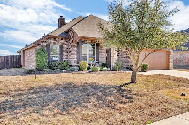 view of front of property with brick siding, a chimney, a shingled roof, concrete driveway, and fence