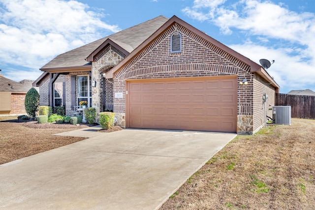 view of front of property with concrete driveway, brick siding, stone siding, and cooling unit