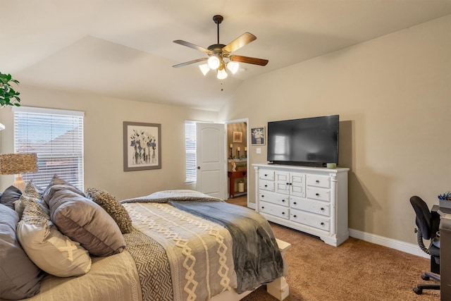 carpeted bedroom with vaulted ceiling, a ceiling fan, and baseboards