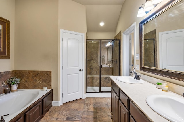 full bath featuring a stall shower, a garden tub, a sink, and double vanity