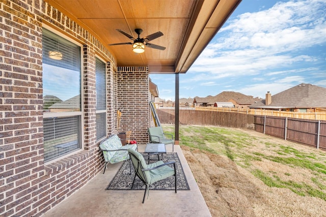 view of patio featuring ceiling fan and a fenced backyard