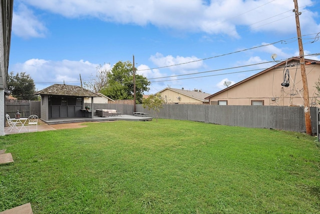 view of yard featuring a patio, a gazebo, and a fenced backyard