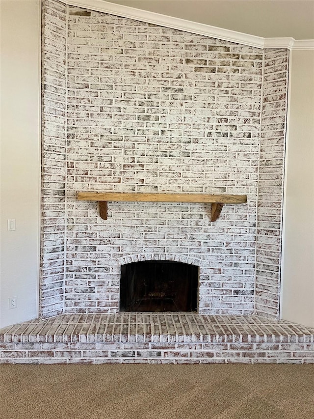 room details with ornamental molding and a fireplace