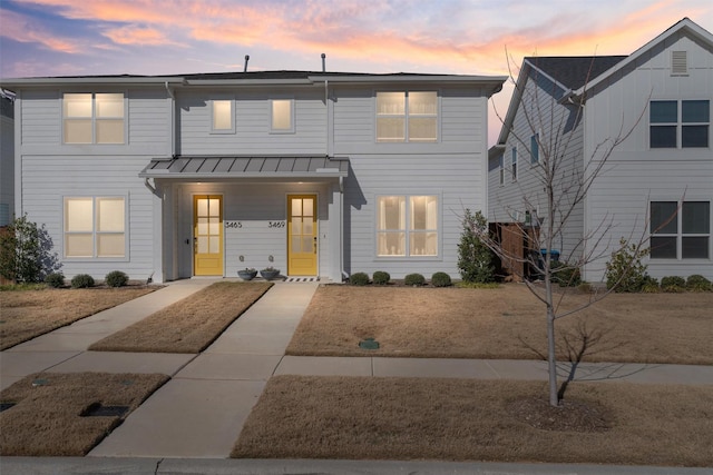 view of front of property with a standing seam roof and metal roof