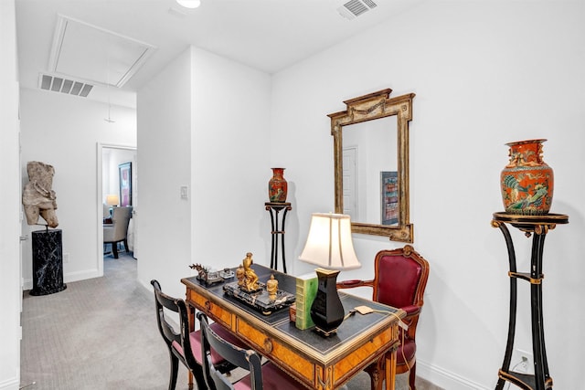 office with baseboards, carpet floors, visible vents, and attic access