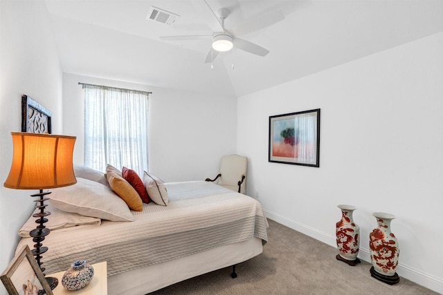 carpeted bedroom featuring vaulted ceiling, ceiling fan, visible vents, and baseboards