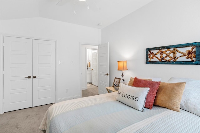 bedroom with baseboards, a ceiling fan, vaulted ceiling, carpet floors, and a closet