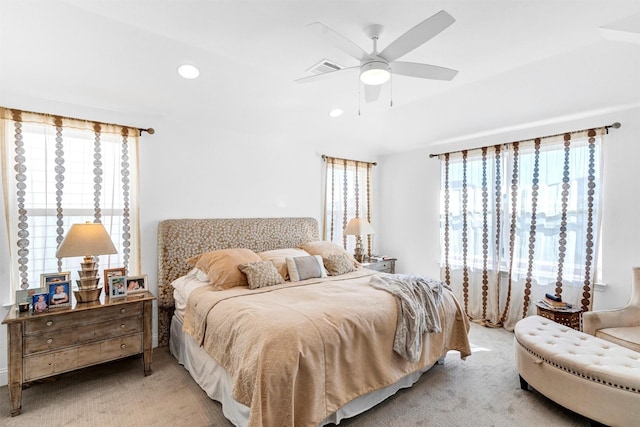 bedroom with light carpet, ceiling fan, multiple windows, and recessed lighting