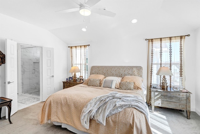 bedroom featuring lofted ceiling, recessed lighting, connected bathroom, and light colored carpet