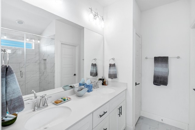 full bath featuring baseboards, marble finish floor, a sink, and a shower stall