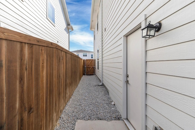 view of home's exterior featuring fence