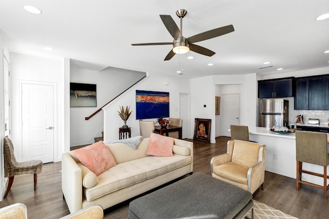 living room with stairs, recessed lighting, ceiling fan, and wood finished floors