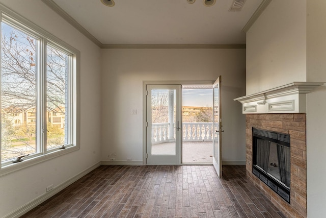 unfurnished living room featuring ornamental molding, baseboards, visible vents, and a tiled fireplace