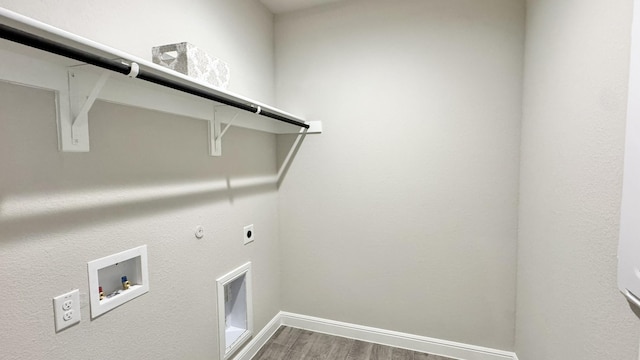 laundry room featuring hookup for a gas dryer, laundry area, washer hookup, wood finished floors, and electric dryer hookup