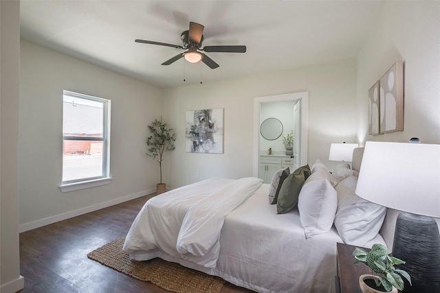 bedroom with ceiling fan, wood finished floors, baseboards, and connected bathroom