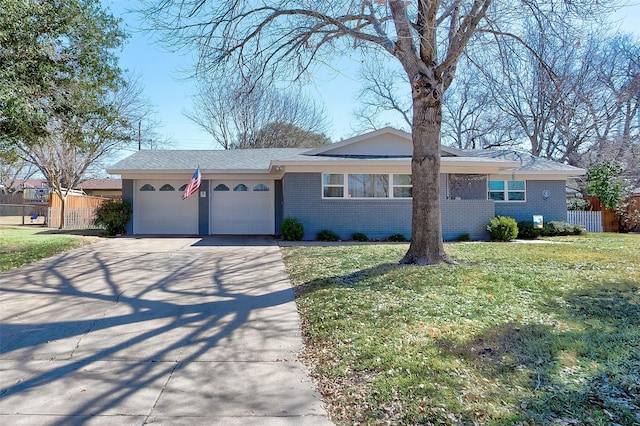 ranch-style home with brick siding, concrete driveway, an attached garage, fence, and a front lawn