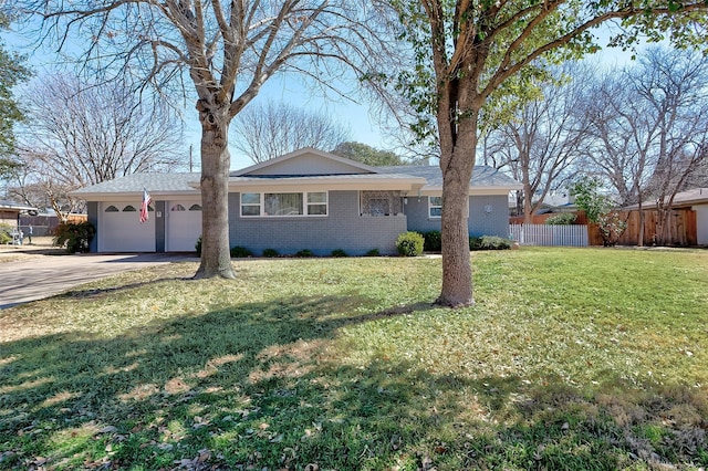 single story home featuring an attached garage, brick siding, fence, concrete driveway, and a front yard