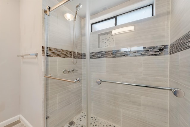 full bath with a shower stall