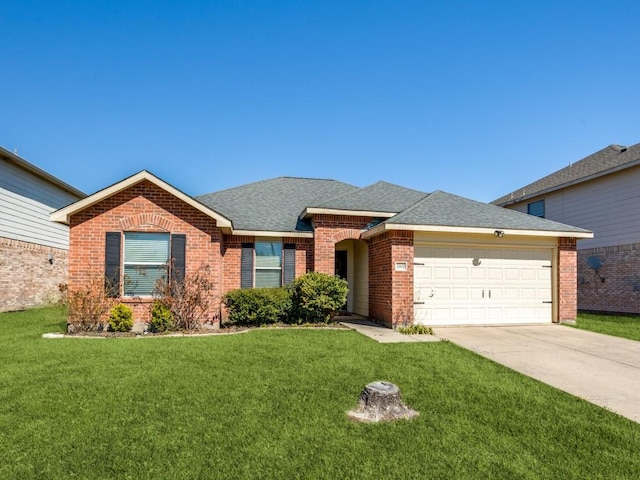 single story home featuring driveway, roof with shingles, an attached garage, a front lawn, and brick siding