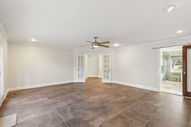 spare room featuring french doors, crown molding, and baseboards