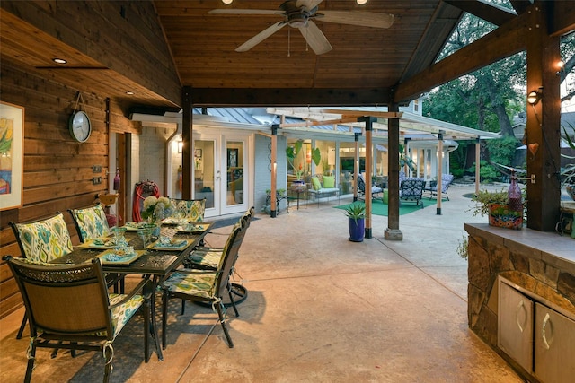 view of patio / terrace featuring outdoor dining space, a ceiling fan, and french doors