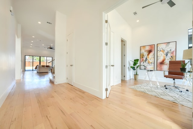 hall featuring recessed lighting, baseboards, visible vents, and light wood finished floors