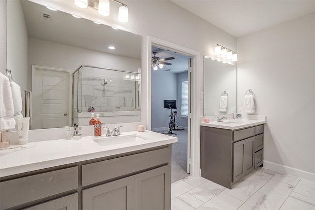 bathroom featuring marble finish floor, visible vents, a ceiling fan, a shower stall, and vanity