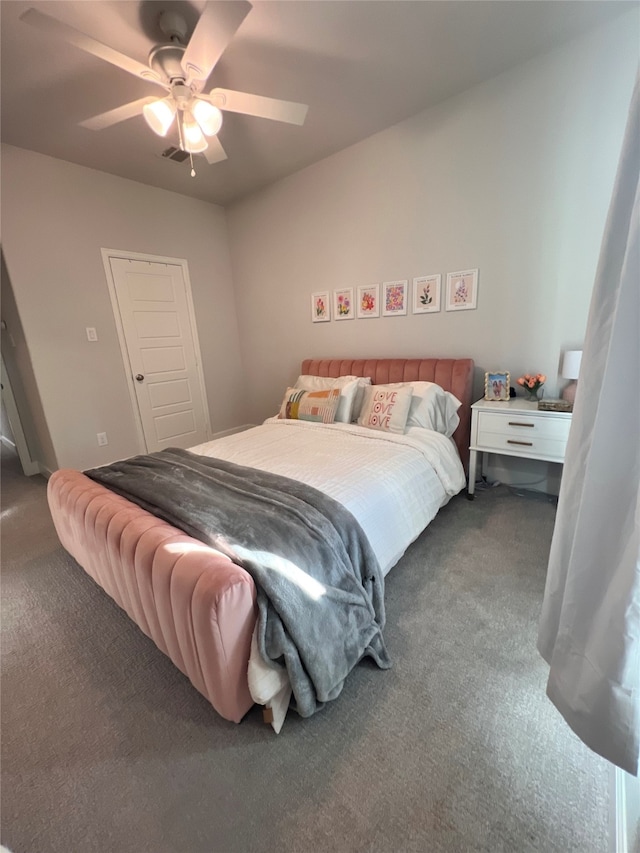 carpeted bedroom with a ceiling fan