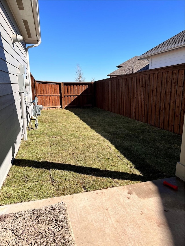 view of yard with a fenced backyard