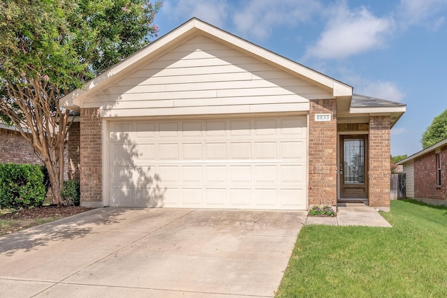 ranch-style house featuring a garage, driveway, brick siding, and a front lawn