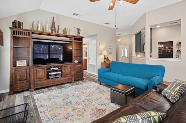 living area with ceiling fan, visible vents, vaulted ceiling, and wood finished floors