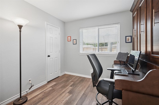 office area featuring wood finished floors and baseboards