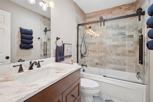 full bathroom with toilet, bath / shower combo with glass door, and vanity