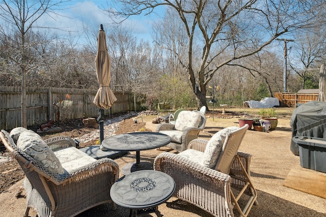 view of patio featuring a fenced backyard and an outdoor hangout area