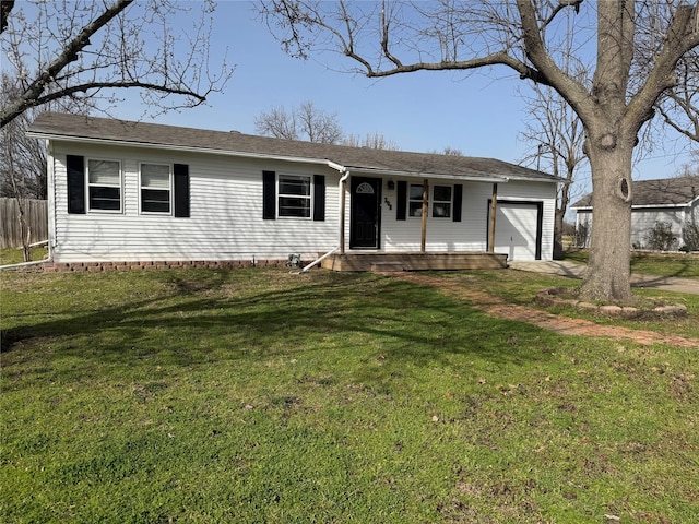 ranch-style house featuring a garage, driveway, fence, and a front lawn