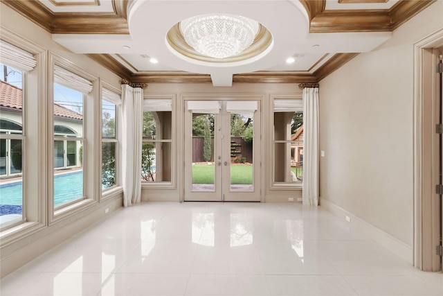 interior space with coffered ceiling, a wealth of natural light, and french doors