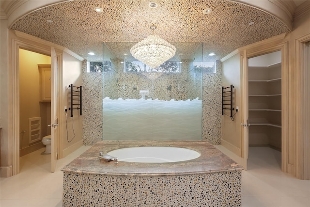 full bathroom featuring a garden tub, toilet, ornamental molding, tiled shower, and tile patterned floors