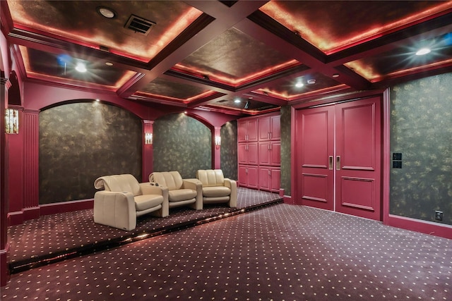 carpeted cinema with beam ceiling, coffered ceiling, and visible vents