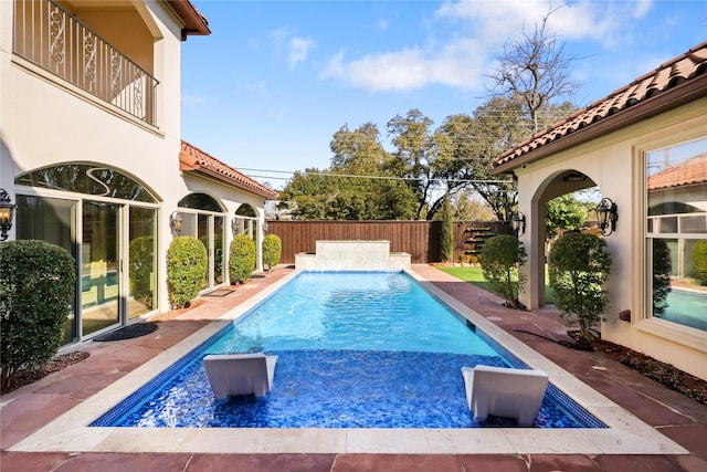 view of pool with a patio area, a fenced backyard, and a fenced in pool