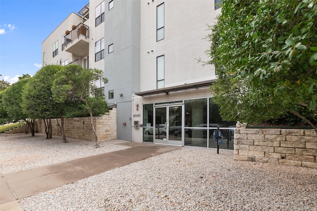 exterior space with a patio area and stucco siding