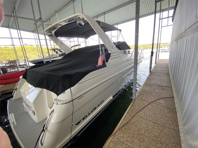 exterior space with a dock and boat lift