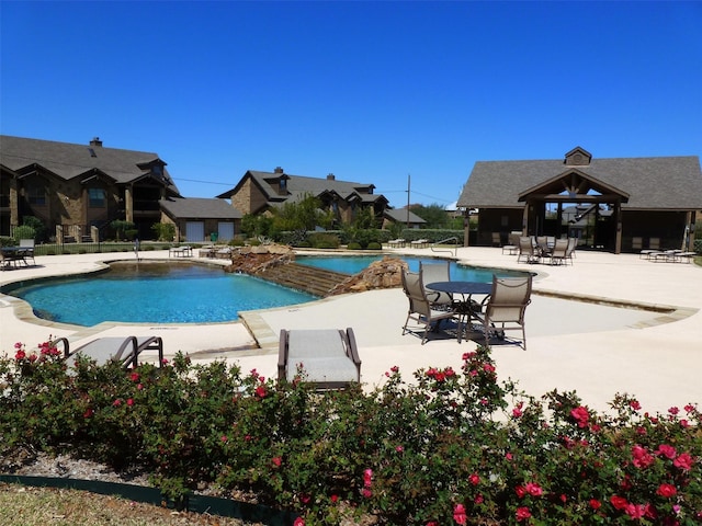 pool featuring a patio area