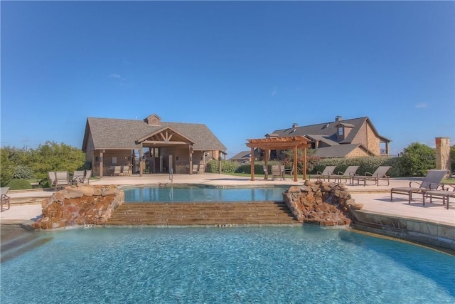 community pool with a pergola and a patio area