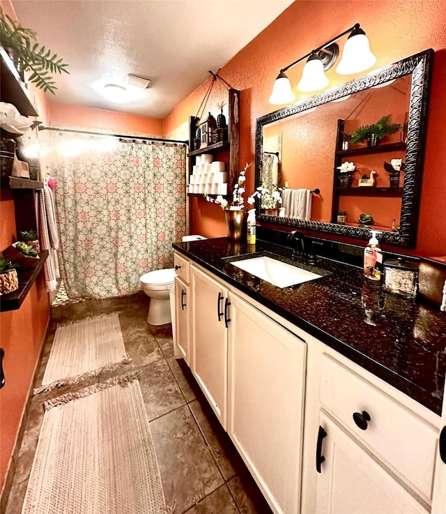 bathroom with toilet, a textured ceiling, a shower with shower curtain, and vanity